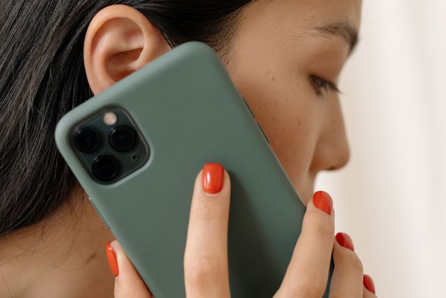 person holding a smartphone to their ear