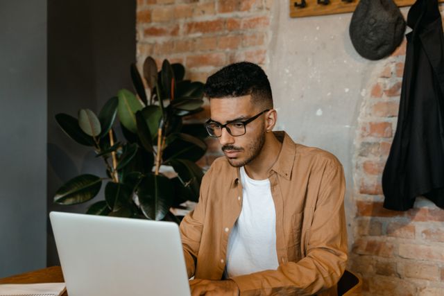 person using a laptop while seated